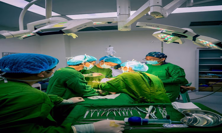 Filipino medical team in an operating room during surgery, some recently hired through urgent hiring overseas jobs with no experience.