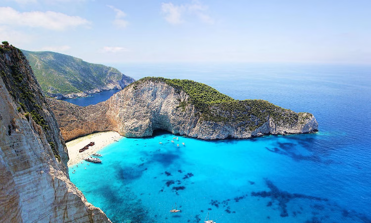 For Filipino applicants seeking POEA Jobs in Greece, Shipwreck Beach (Navagio) in Zakynthos offers striking white limestone cliffs and a famous shipwreck — the perfect place to while away the time.