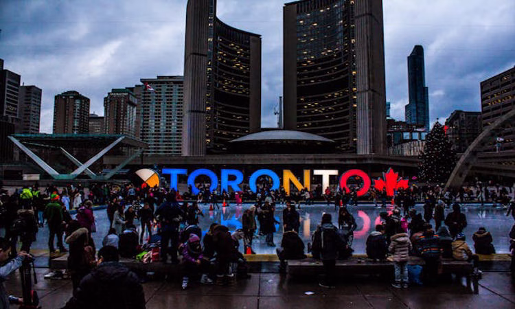 A stand in Toronto with a street with a bustling night scene. This is a nice place where probably Filipino will congregate after finding Philippine Jobs Canada.